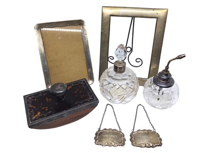 Lot 229 - Two silver photograph frames, two silver spirit labels, silver mounted tortoise shell ink blotter and two glass scent bottles