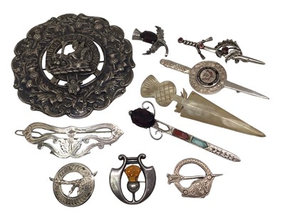 Lot 233 - Group of Scottish brooches including some silver