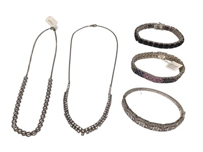 Lot 239 - Group of contemporary silver gem set jewellery to include a multi gem set bangle, gem set bracelet, Swarovski zirconia bangle and two necklaces, all packaged as new (5)