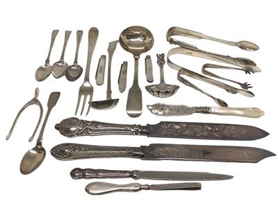 Lot 272 - Collection of silver  items to include Scottish silver sugar tongs, silver and mother of pearl fruit knives, George IV Scottish silver cream/sauce ladle Glasgow 1827, Georgian silver three-prong fo...