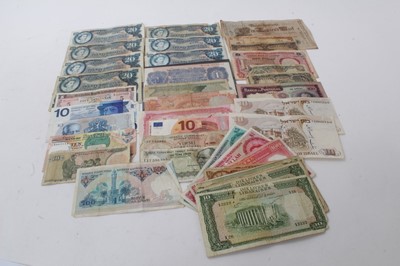 Lot 547 - World - Mixed banknotes to include G.B. Blue £1 peppiatt prefix N55E EF, East African Currency Board Elizabeth II Twenty Shiilings x 7 (N.B. Taken from circulation) & other issues (Qty)