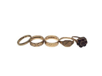 Lot 254 - Two 9ct gold wedding rings, one other stamped 333, 9ct gold signet ring and 9ct gold garnet cluster ring (5)