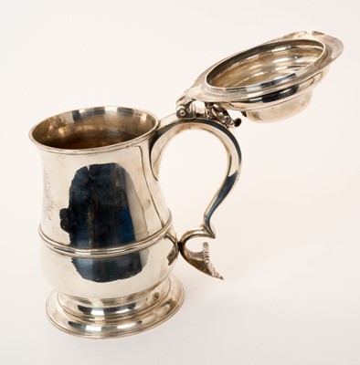 Lot 388 - Large George II lidded silver tankard