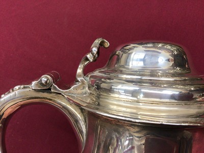 Lot 388 - Large George II lidded silver tankard