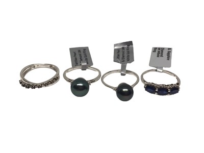 Lot 298 - Two 18ct white gold Tahitian cultured black pearl and diamond rings, and two 9ct gold diamond and gem-set dress rings (4)