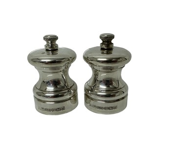 Lot 34 - Pair of contemporary silver pepper grinders, (Birmingham 2003), with Cole & Mason mechanics, 7cm high