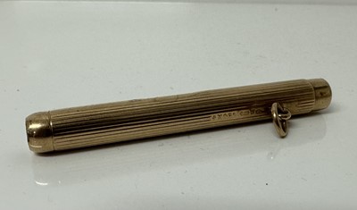 Lot 40 - Sampson Mordan 9ct gold propelling pencil with ribbed decoration, 7cm long