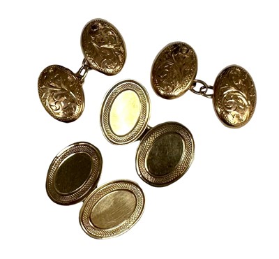 Lot 41 - Pair of 9ct gold oval cufflinks with engine turned border together with another pair of 9ct gold oval cufflinks with engraved foliate decoration, 9.4 grams