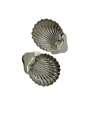 Lot 49 - Pair of Edwardian silver shell-shaped butter dishes, on ball feet, by George Unite (Birmingham 1906), 3.2ozs