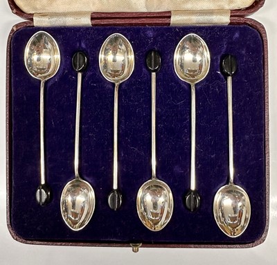 Lot 51 - Set of six George VI silver coffee bean spoons in fitted case (Chester 1936). All at 1.1ozs