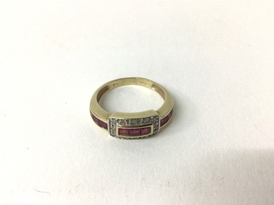 Lot 168 - Ruby and diamond ring with a rectangular diamond bezel and a band of calibre cut rubies