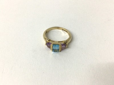 Lot 167 - Amethyst and blue topaz three-stone ring