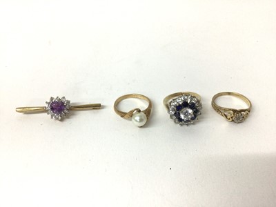 Lot 172 - Group of three 9ct gold dress rings and a 9ct gold and amethyst brooch (4)