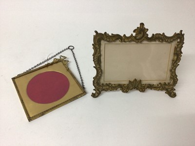 Lot 140 - Good quality Edwardian rococo revival ormolu photograph frame with easel back 17 x 19cm and another gilt framed square frame with ribbon cresting 19.5 x 18.5cm (2)