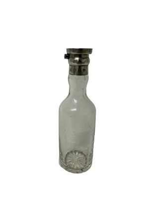 Lot 202 - Victorian silver mounted glass bottle, possibly for whisky, with hinged cover, (Birmingham 1897), maker Hukin & Heath, 13.5cm in overall height