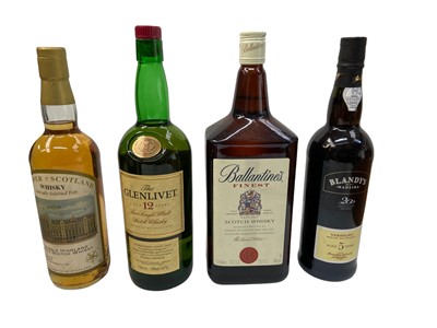 Lot 402 - Nine bottles, Glen Ord 12 year old, Isle of Jura 10 year old, The Glenlivet 12 year old, Flower of Scotland Whisky, Ballantines 1.5 litre, Famous Grouse, Chivas Regal, Blandy's Madeira and Bas Arma...
