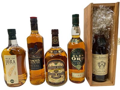 Lot 402 - Nine bottles, Glen Ord 12 year old, Isle of Jura 10 year old, The Glenlivet 12 year old, Flower of Scotland Whisky, Ballantines 1.5 litre, Famous Grouse, Chivas Regal, Blandy's Madeira and Bas Arma...