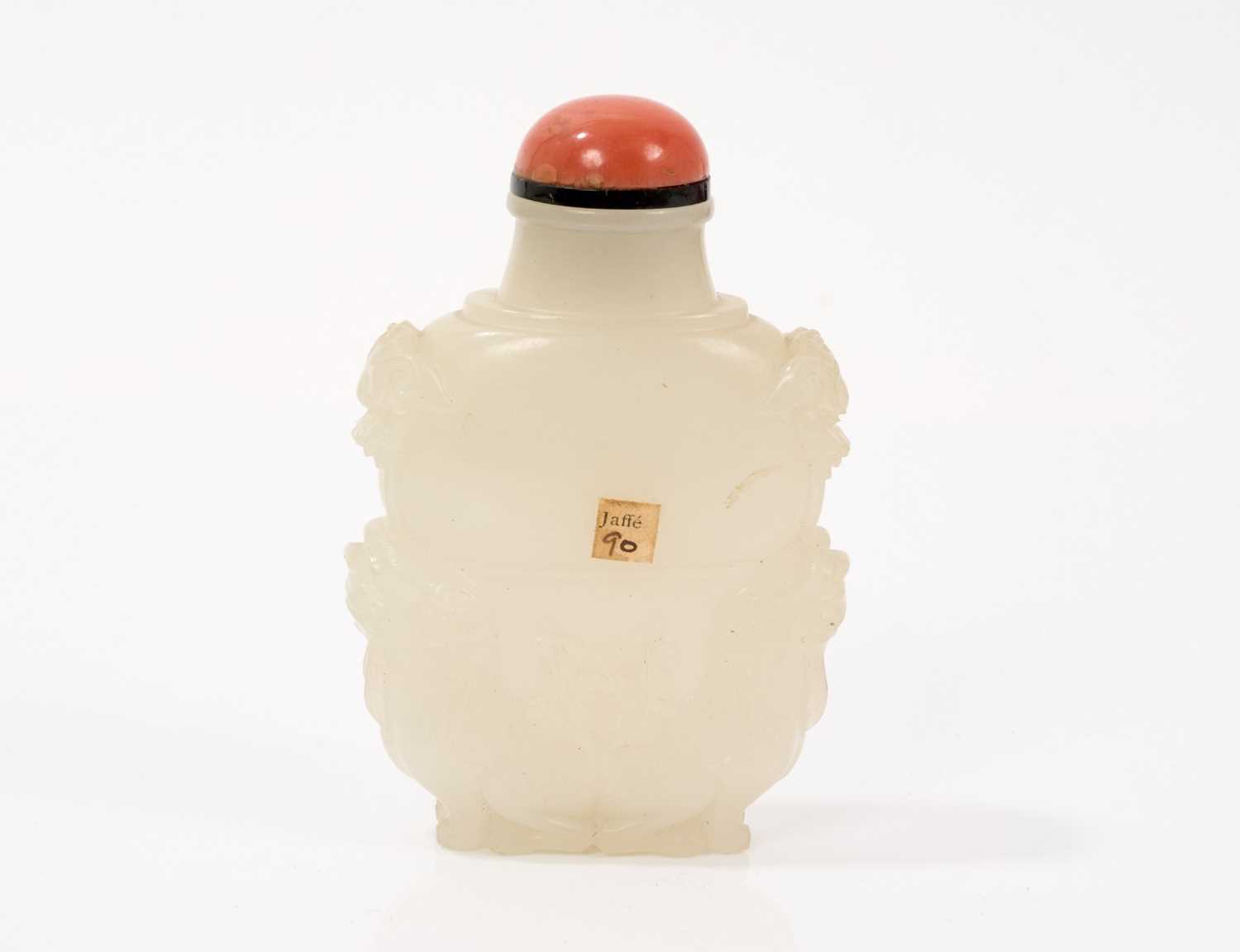 Lot 791 - Finely carved celadon jade snuff bottle, with qilin supports