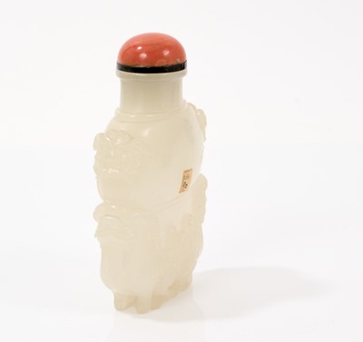 Lot 791 - Finely carved celadon jade snuff bottle, with qilin supports
