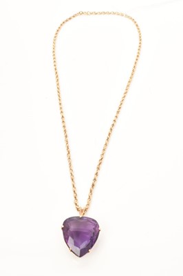 Lot 431 - Large amethyst heart shape pendant with a fancy cut heart shaped amethyst in 9ct gold setting on a 9ct gold rope twist chain