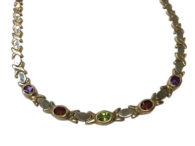Lot 90 - 9ct yellow and white gold cross and oval link necklace set with five multi-coloured gem stones, 41cm long