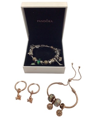 Lot 1008 - Two Pandora Moments charm bracelets and pair of earrings