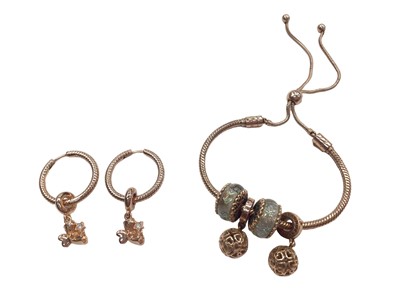 Lot 1008 - Two Pandora Moments charm bracelets and pair of earrings