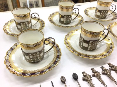 Lot 1082 - Set of six Aynsley coffee cans in pierced silver cup mounts and six matching saucers, together with a group of various silver and white metal tea/coffee spoons