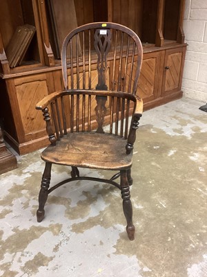 Lot 1200 - Early 19th century Windsor elm stick back elbow chair with shaped seat on turned legs joined by crinoline stretcher