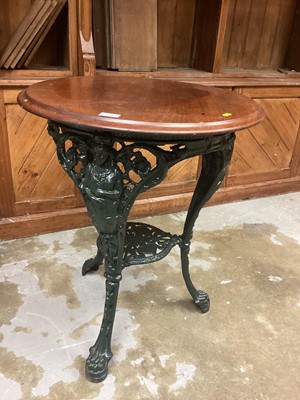 Lot 1206 - Victorian cast iron framed pub table with circular mahogany top and cast Britannia figure decoration