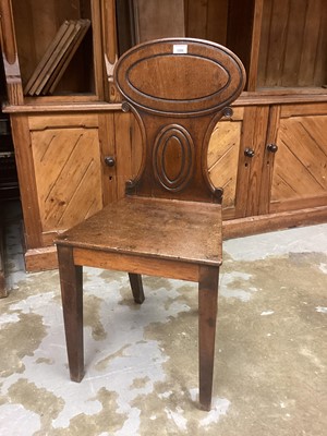 Lot 1208 - Regency mahogany hall chair with oval panelled back, solid seat on taper legs