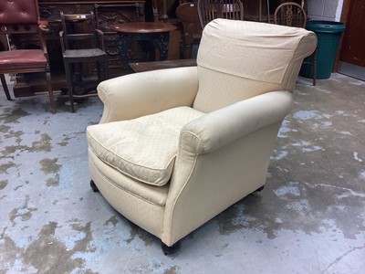 Lot 1315 - Edwardian deep upholstered easy chair with cream upholstery on bun feet