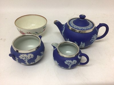 Lot 117 - Wedgwood blue jasper dip small teapot and cover, milk jug and sugar bowl, with silver mounted rims, and a Royal Worcester small round bowl