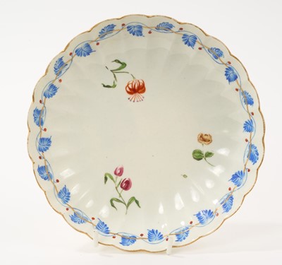 Lot 172 - Unusual Worcester fluted saucer dish, London decorated with three flowers, within a dry blue enamel band of leaves and iron red berries