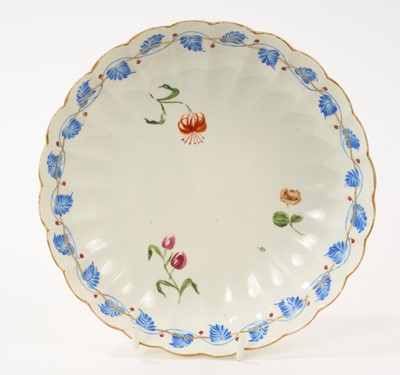 Lot 54 - Unusual Worcester fluted saucer dish, London decorated with three flowers, within a dry blue enamel band of leaves and iron red berries