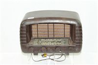 Lot 3766 - Strad brown bakelite radio with four central...