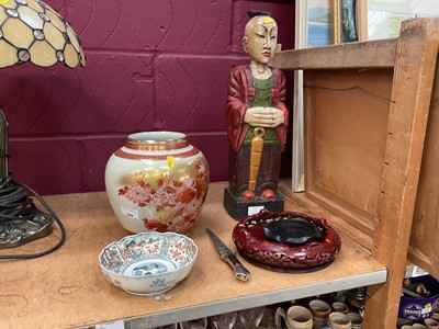 Lot 709 - Eastern carved wood daity figure together with a Japanese Satsuma vase, two hardwood stands, a bowl and a dagger.