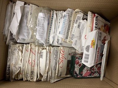 Lot 211 - Selection of vintage sewing patterns, mainly uncut and large box of carded buttons