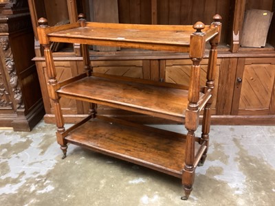 Lot 1227 - Victorian oak three tier buffet trolley with reeded colomn. Supports on castors 106 cm wide