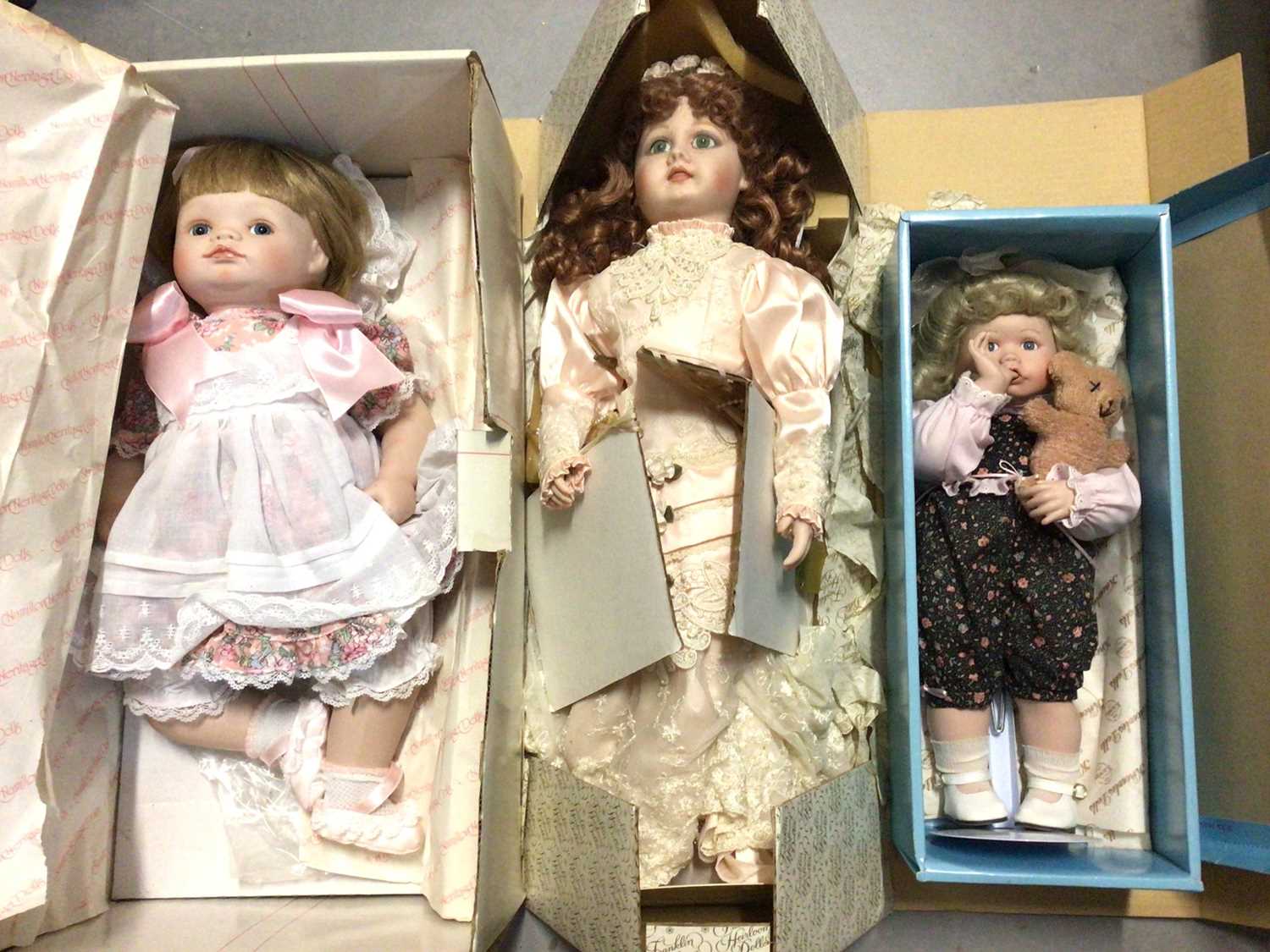 Lot 324 Three boxed porcelain dolls one other doll