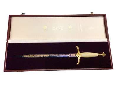 Lot 322 - Queen Elizabeth II Ruby Jubilee Poignard with an etched steel blade, gold plated hilt and simulated ivory grip in fitted case