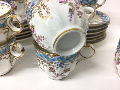 Lot 137 - Minton blue ribbon and pink rose swag pattern tea set, comprising of 18 saucers, 11 tea cups, 6 coffee cups and one jug