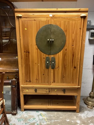 Lot 1243 - Eastern pine television cabinet/ cupboard with brass mounts and drawers and shelf below 106 cm wide, 175cm high, 53cm deep