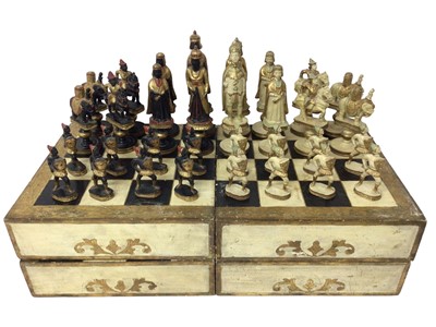 Lot 846 - Italian carved wooden and gesso chess set in the form of Moors and Crusaders