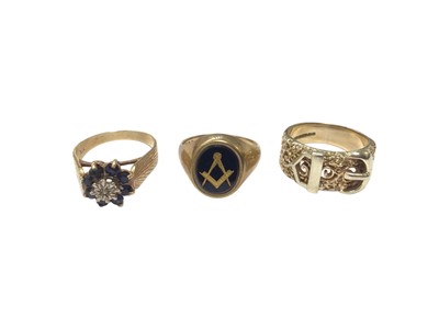 Lot 100 - Three 9ct gold rings to include a sapphire and diamond cluster ring, Masonic signet ring and a buckle ring