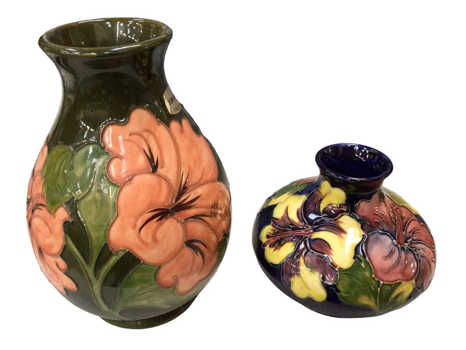 Lot 347 - Two Moorcroft pottery vases decorated in the Hibiscus pattern