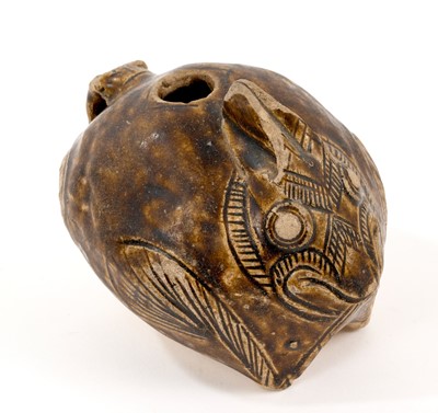 Lot 131 - 12th century Khmer brown glazed smiling rabbit lime pot