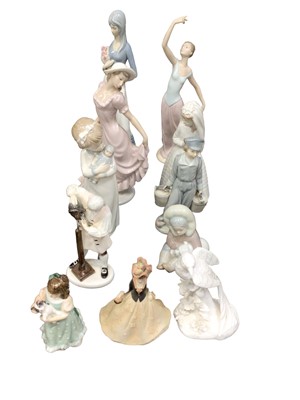 Lot 157 - Group of porcelain figurines to include Royal Doulton 'The Wigmaker of Williamsburg' HN2239, Lladro, Nao etc