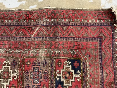 Lot 1381 - Rug with geometric pattern on red and blue ground