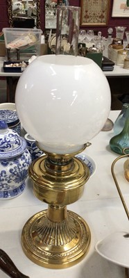 Lot 327 - Brass oil lamp with glass shade, brass hanging lamp with enamel shade, together with a small copper warming pan and copper coal shovel